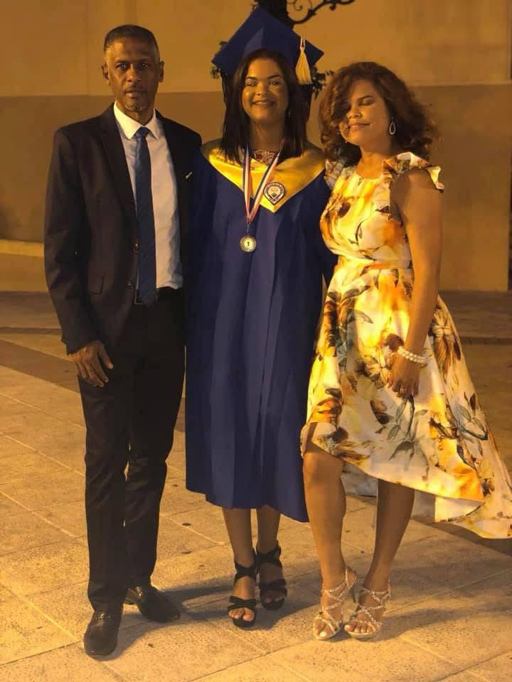 Early years — secondary-school graduation with my parents